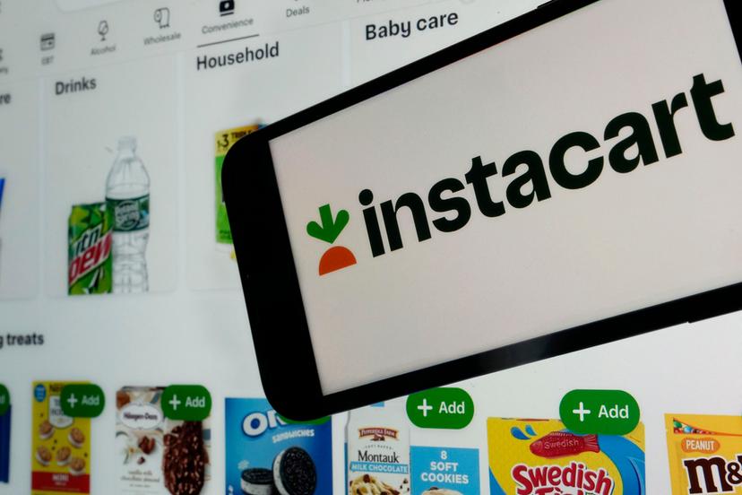 n instacart logo and an instacart webpage are shown in this photo, in New York, Wednesday, Sept. 6, 2023.