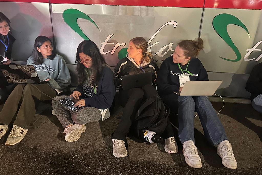 Staff members of the Columbia Daily Spectator, the college newspaper, work into the night as police cleared out demonstrators from Columbia University's campus